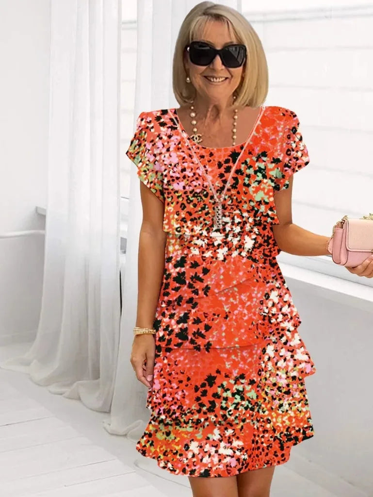 Barbara – Elegante vestido vaporoso con volantes