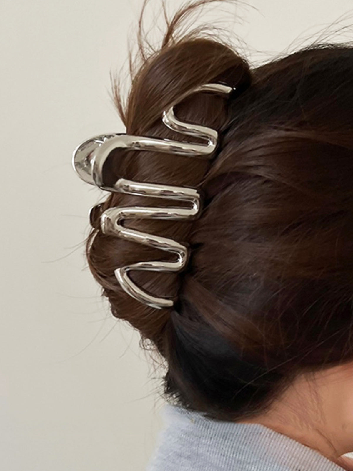 Garra esencial para el cabello